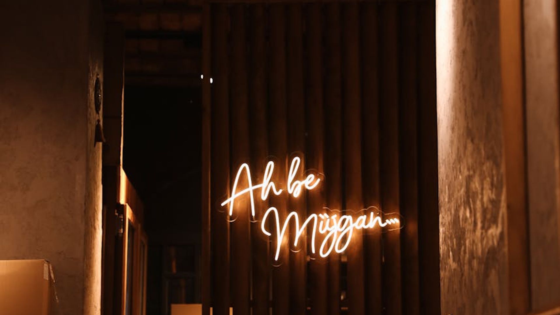 Atmospheric training room with dark walls and soft neon lighting.