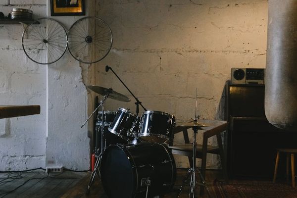 Person doing dynamic movements in a minimalist loft studio.